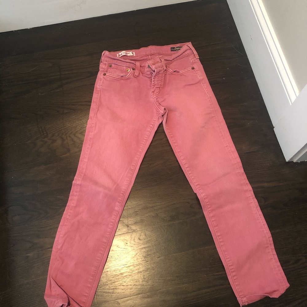 Pink fire engine skinny jeans.